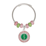 PinktownUSA - AKA Greek Merch Bead and Charm Cable Bracelet: Color: Pink and Green / Plating: Rhodium / Size: Adjustable