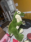 Kid items a Dinosaur, sock and Tee-Shirt